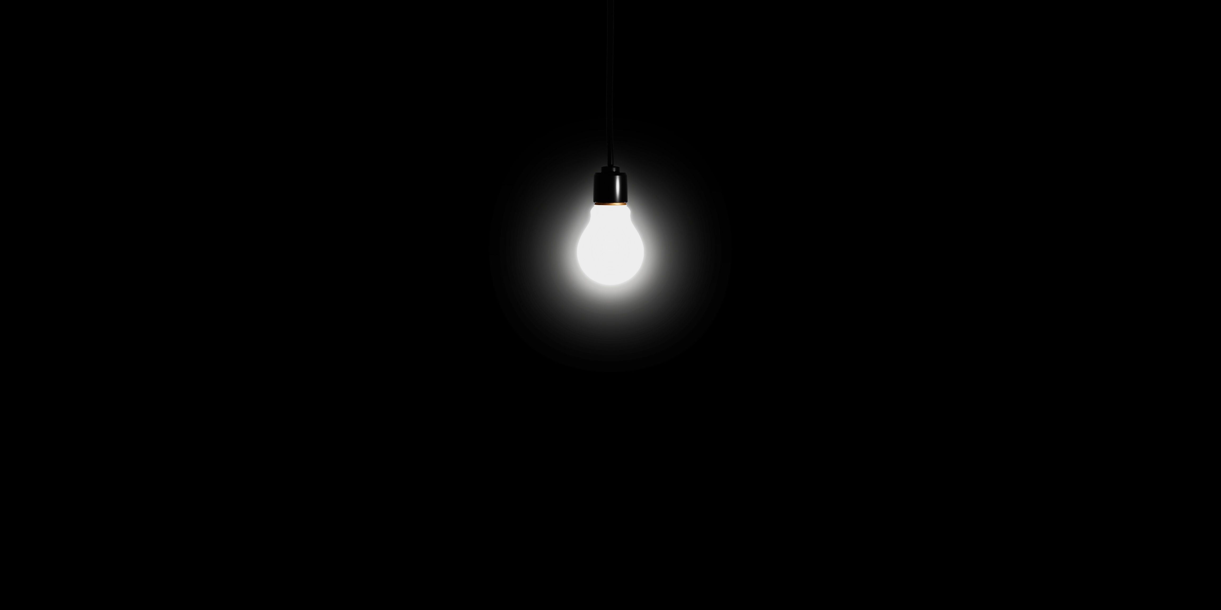 light bulb on cord in black room