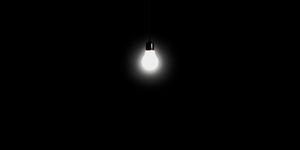 light bulb on cord in black room